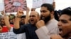 People shout slogans as they participate in a protest against the rape of an eight-year-old girl in Kathua near Jammu, and a teenager in Unnao, Uttar Pradesh state, in Mumbai, Apr. 15, 2018. 