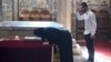 Serbs pray before the tomb of "holy king" Stefan Dečanski. The church and monastery of Visoki Dečani is protected by soldiers from the NATO-led international peacekeeping force, KFOR. The monastery has been attacked several times since the end of the Kosovo War, the last time in 2007.