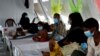 FILE - Rohingya refugees, who suffer from diphtheria, are treated at a Medecins Sans Frontieres (MSF) clinic near Cox's Bazar, Bangladesh, Dec. 18, 2017.