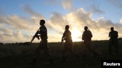 FILE - Somali army soldiers are seen near Barawe, Somalia, Oct. 4, 2014. Somalian soldiers might soon join peacekeeping forces in South Sudan.