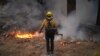 A firefighter works to contain the Bridge Fire in Wrightwood, California, Sept. 11, 2024.