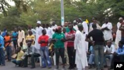 After casting ballots, Voters wait at their polling station in Abuja to hear the results