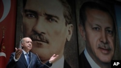 Turkey's President Recep Tayyip Erdogan addresses his ruling party members, in Ankara, Turkey, July 26, 2019.