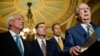 Majority Leader Mitch McConnell, backed by, from left, fellow Republican Senators Roger Wicker, John Barrasso and John Thune, speaks on Capitol Hill, where he later called passage of the USA Freedom Act a victory for U.S. enemies, June 2, 2015.