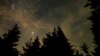 In this 30 second exposure, a meteor streaks across the sky during the annual Perseid meteor shower, Wednesday, Aug. 11, 2021, in Spruce Knob, West Virginia. Photo Credit: (NASA/Bill Ingalls)