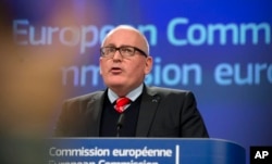 European Commission Vice President Frans Timmermans speaks during a media conference at EU headquarters in Brussels, Dec. 20, 2017.