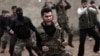 FILE - Syrian rebels attend a training session in Maaret Ikhwan near Idlib, Syria. 
