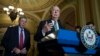 Senate Majority Leader Mitch McConnell of Ky., right, accompanied by Senate Veterans Affairs Committee Chairman Sen. Johnny Isakson, R-Ga., speaks during a news conference on Capitol Hill in Washington.