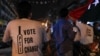 Supporters of Pakistan Tehreek-e-Insaf (PTI) political party celebrate along the road during the general election in Karachi, Pakistan, July 25, 2018.
