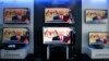 Malaysia's Prime Minister Najib Razak is seen on TV during a news bulletin as he announces the dissolution of parliament, at an electronics shop in Kuala Lumpur, April 3, 2013.
