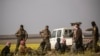 Men suspected of being Islamic State group fighters arrive at a screening point run by U.S.-backed Syrian Democratic Forces, where suspected jihadists, many of them wounded, were being interrogated outside Baghuz in northeastern Syria, March 6, 2019.
