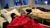 FILE - Women are treated for a suspected cholera infection at a hospital in Sana'a, Yemen, May 15, 2017.