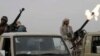 FILE - A Houthi rebel fighter fires in the air during a gathering aimed at mobilizing more fighters for the Houthi movement, in Sana'a, Yemen, Aug. 1, 2019. 