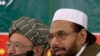 Hafiz Mohammad Saeed, right, chief of Jamaat-ud-Dawwa and founder of Lashkar-e-Taiba, addresses a news conference with anti-American cleric Sami ul Haq in Rawalpindi, Pakistan, April 4, 2012.