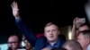 FILE - Andrei Ishchenko, Communist Party candidate in gubernatorial elections in Russia's far-eastern Primorsky Krai region, center, attends a rally with supporters, in Vladivostok, Sept. 17, 2018.