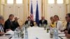 FILE - U.S. Secretary of Energy Ernest Moniz, U.S. Secretary of State John Kerry and U.S. Under Secretary for Political Affairs Wendy Sherman (L-3rd L) meet with European Union foreign policy chief Federica Mogherini (2nd R) at a hotel in Vienna, Austria, June 28, 2015, as the deadline for a nuclear deal with Iran approaches.