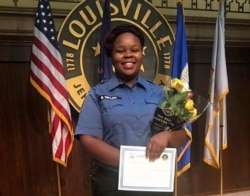 FILE - This undated photo provided by Taylor family attorney Sam Aguiar shows Breonna Taylor in Louisville, Ky.