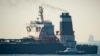 FILE - Royal Marine patrol vessel is seen beside the Grace 1 super tanker in the British territory of Gibraltar, July 4, 2019.