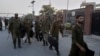 Pakistani police officers arrive to take positions for security at the office of National Accountability Bureau following the opposition leader arrest, in Lahore, Pakistan, Oct. 5, 2018. 