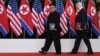 U.S. President Donald Trump and North Korea's leader Kim Jong Un walk during their summit at the Capella Hotel on Sentosa island in Singapore, June 12, 2018.