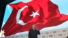 FILE - Turkey's President Recep Tayyip Erdogan talks to supporters of his ruling Justice and Development Party during an event to announce the party's "manifesto" ahead of countrywide local elections scheduled for March 31, in Ankara, Jan. 31, 2019.