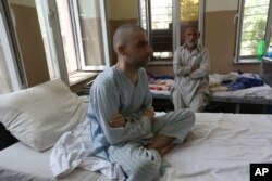 FILE - Patients are treated in the Mental Health and Drug Addicts' Hospital in Kabul, Afghanistan, July 17, 2016.
