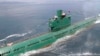 FILE - North Korean leader Kim Jong Un (L) stands on the conning tower of a submarine during his inspection of the Korean People's Army (KPA) Naval Unit 167 in this undated photo released by North Korea's Korean Central News Agency (KCNA) in Pyongyang.