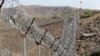 A view of the border fence outside the Kitton outpost on the border with Afghanistan in North Waziristan, Pakistan, Oct. 18, 2017. 
