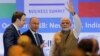 FILE - India's Prime Minister Narendra Modi waves as Russian President Vladimir Putin looks on after attending the India-Russia Business Summit in New Delhi, India, Oct. 5, 2018. 