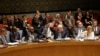 Members of the Security Council vote in favor of putting North Korea's human rights situation on the council's agenda during a meeting on Monday, Dec. 22, 2014.