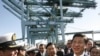 Chinese Vice President Xi Jinping , right, shakes hands with officers as he tours China Shipping at the Port Of Los Angeles in San Pedro, Calif. on Feb. 16, 2012.