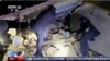 In this image taken from video footage run by China's CCTV, rescuers work near the rubble from an earthquake in Kizilsu Kirghiz Autonomous Prefecture, China’s western Xinjiang region, Jan. 23, 2024. 