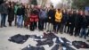 Academics lay down their gowns during a protest against the dismissal of academics from universities following a post-coup emergency decree, in the Cebeci campus of Ankara University in Turkey, Feb. 10, 2017.
