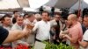 FILE - Ekrem Imamoglu, Istanbul mayoral candidate of the main opposition Republican People's Party (CHP), shakes hands with a vendor at a vegetable market in Istanbul, Turkey, May 29, 2019.