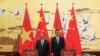 FILE - Chinese Premier Li Keqiang with Vietnamese Prime Minister Nguyen Xuan Phuc (L) attend a signing ceremony at the Great Hall of the People in Beijing, China.