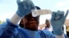 A health worker prepares an Ebola vaccine to administer to health workers during a vaccination campaign in Mbandaka, Congo, May 21, 2018.
