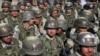 FILE - Afghan special police forces attend their graduation ceremony at a special forces training center in Kabul, Feb. 22, 2018. 