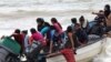 Venezuelan migrants, who were recently deported, arrive at shore on Los Iros Beach after their return to the island, in Erin, Trinidad and Tobago, Nov. 24, 2020. (Lincoln Holder/Courtesy Newsday/Handout via Reuters)