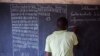 An election worker tallies votes after the close of polls in Mali's presidential runoff, Bamako, August 11, 2013. 