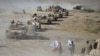 Shi'ite Popular Mobilization Forces gather with Iraqi army troops on the outskirts of Tal Afar, Iraq, Aug. 22, 2017.