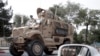FILE - A U.S. armored vehicle patrols in Kabul, Afghanistan, Aug. 23, 2017. 