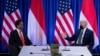 President of Indonesia Joko Widodo, left, listens as U.S. President Joe Biden makes a statement for the press before a bilateral meeting at the COP26 UN Climate Change Conference in Glasgow, Scotland, on Nov. 1, 2021.