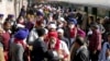 Indian Sikh pilgrims arrive at Wagha railway station to attend the birth anniversary of their spiritual leader Baba Guru Nanak, in Pakistan, Wednesday, Nov. 21, 2018.