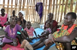 FILE - Recently displaced families shelter in a run-down school in Akobo, near the Ethiopian border, in South Sudan, Jan. 19, 2018.