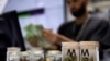 FILE - A cashier rings up a marijuana purchase at a cannabis dispensary in Las Vegas, Nevada, July 1, 2017.