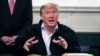 FILE - President Donald Trump talks to reporters during the signing of a spending bill to combat the coronavirus, at the White House March 6, 2020, in Washington.
