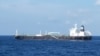 This handout photo received on August 25 from the Indonesian Navy shows the Bahamian-flagged MT. Strovolos near the Riau islands. The tanker and its crew who were wanted on charges of stealing nearly 300,000 barrels of crude oil from Cambodia's reserves. (AFP/INDONESIA NAVY)