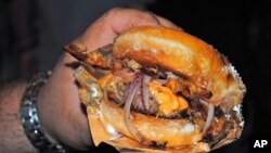 Our man Baragona's reaction to this photo of a Krisy Kreme Burger (bacon cheeseburger with two doughnuts forming the bun): I'm speechless. And a little nauseous.