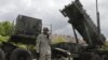 A U.S. soldier stands next to a Patriot surface-to-air missile battery at an army base in Morag, Poland. (File)