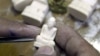 Thai carver works on ivory sculpture of a Buddhist monk in Nakhon Sawan province, Thailand (undated file photo).